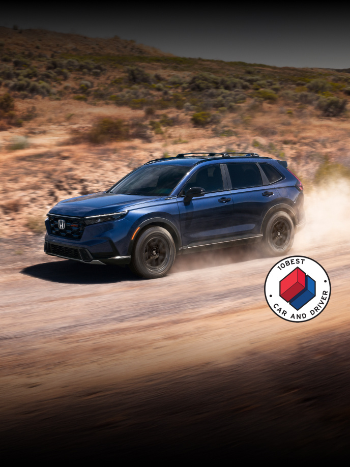 2026 Honda CR-V TrailSport Hybrid in Canyon River Blue Metallic with overlapping Car and Driver 10Best logo (Compact Crossover SUV).