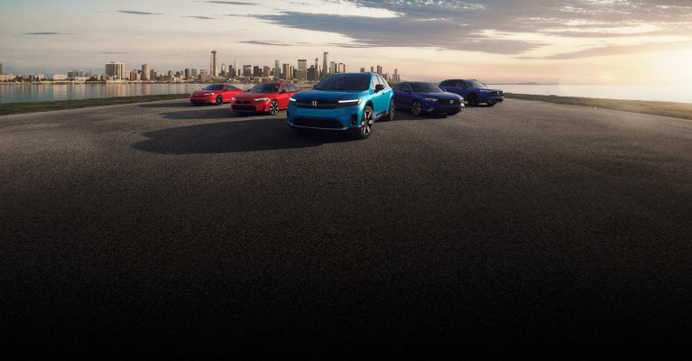 2026 Honda Electrification lineup parked with the city far in the background, showing Prelude, Civic Sedan, Prologue, Accord and CR-V.