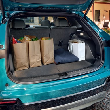 2026 Honda Prologue Elite interior, featuring the rear hatch cargo area with groceries inside.