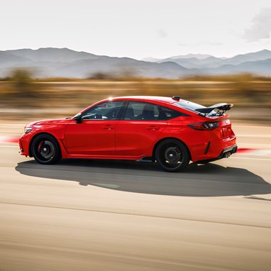2026 Honda Civic Type R in Rallye red driving on a race track