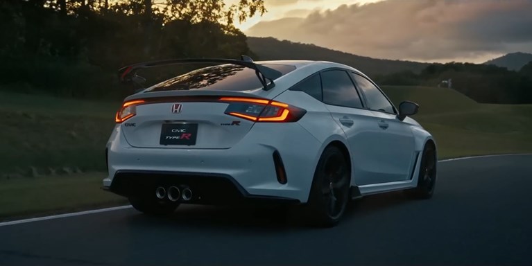 2026 Honda Civic Type R in Championship White driving greenery on the background